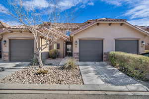 View of front of property featuring a garage