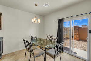 Dining area with an inviting chandelier