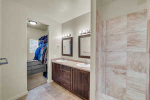 Bathroom featuring vanity and a textured ceiling