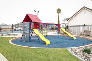 View of play area with a yard