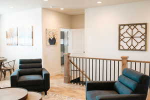 Living area with light wood-type flooring