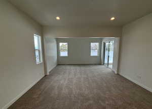 Spare room featuring light colored carpet