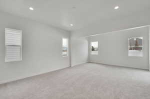 Spare room with light colored carpet