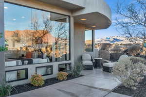 View of patio / terrace featuring a mountain view and exterior kitchen