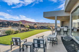 View of patio featuring a bar and a mountain view