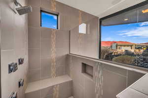 Bathroom featuring a mountain view and tiled shower