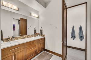 Bathroom with vanity and backsplash