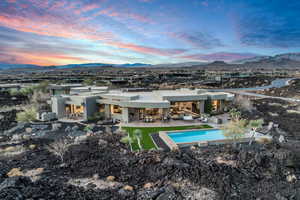 Exterior space with a mountain view, an outdoor bar, and a patio area