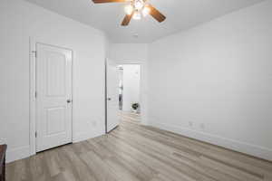 Unfurnished bedroom with light hardwood / wood-style floors and ceiling fan