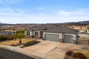 View of front facade featuring a mountain view and a garage