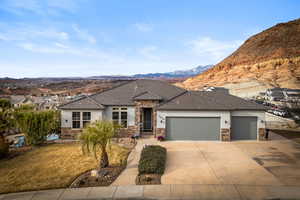 View of front facade featuring a mountain view and a garage