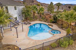 View of pool with a mountain view, an in ground hot tub, and a patio area