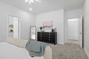 Bedroom with light carpet and ceiling fan