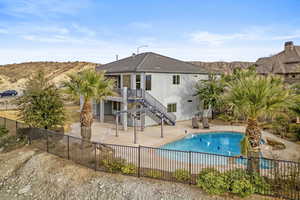 View of pool featuring a mountain view and a patio