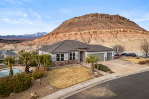 View of front of house with a garage and a mountain view