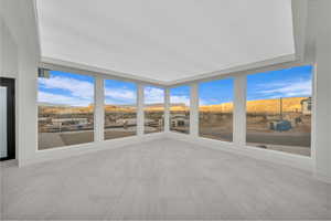 Unfurnished sunroom with a mountain view