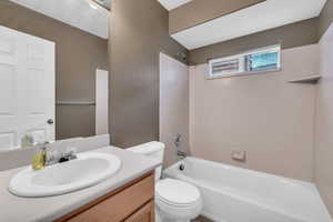 Full bathroom with vanity, toilet, and bathing tub / shower combination