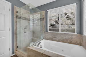 Bathroom featuring separate shower and tub