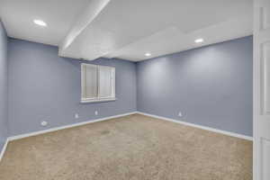 Unfurnished room featuring carpet flooring