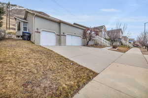 View of property exterior featuring a garage