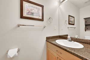 Bathroom featuring vanity and toilet