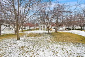 View of yard layered in snow