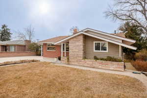 View of front of property with a front yard