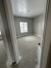 Spare room featuring a textured ceiling