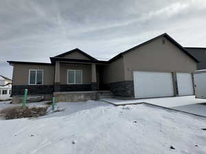 View of front of property with a garage