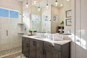 Bathroom featuring vanity and walk in shower