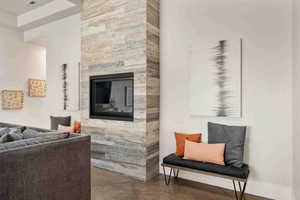 Interior space with concrete flooring and a large fireplace