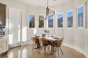 Dining space with an inviting chandelier and a mountain view