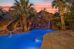 View of pool at dusk