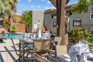 View of swimming pool featuring a pergola and a patio area