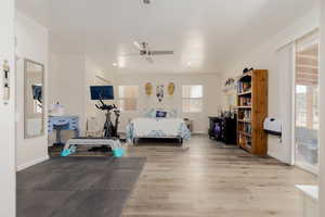 Bedroom with wood-type flooring and ceiling fan