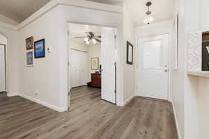 Foyer entrance featuring light hardwood / wood-style floors and ceiling fan