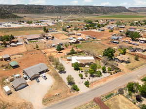 Birds eye view of property with a rural view