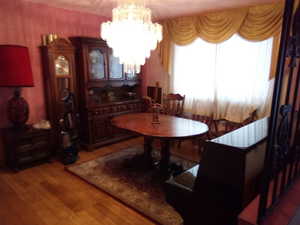Dining area with an inviting chandelier and light wood-type flooring