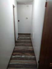 Stairway featuring hardwood / wood-style flooring