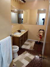 Bathroom with vanity and toilet