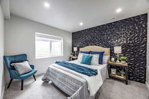 Carpeted bedroom featuring a textured ceiling