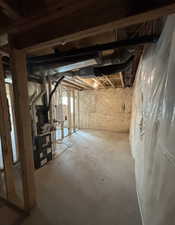 Basement featuring heating unit