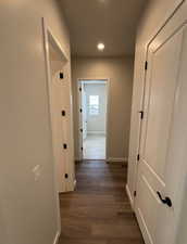 Hallway featuring dark hardwood / wood-style flooring