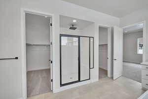 Bathroom featuring tile patterned flooring and an enclosed shower