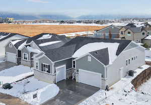 Snowy aerial view with a mountain view