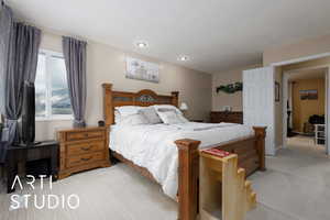 Bedroom with light colored carpet