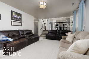 Living room featuring carpet floors