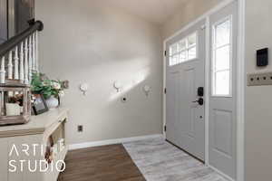 Foyer entrance featuring hardwood / wood-style flooring