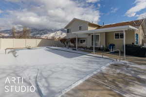 Exterior space with a mountain view and a patio area