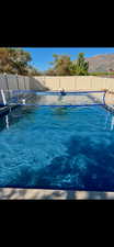 View of swimming pool featuring a mountain view